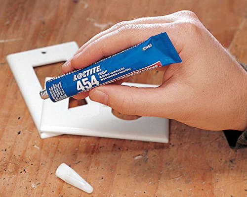 Гель Loctite 454 у тубі над пластиковою рамкою Гель Loctite 454 у тубі над пластиковою рамкою